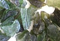 Moldavite Origins and Meaning: Unearthing Its Hidden Powers