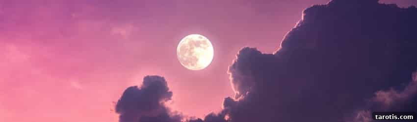 10 Essential Elements to Include in Your Monthly Full Moon Ritual 4 A Full Moon on a purple sky with dark purple clouds floating beneath the Moon.
