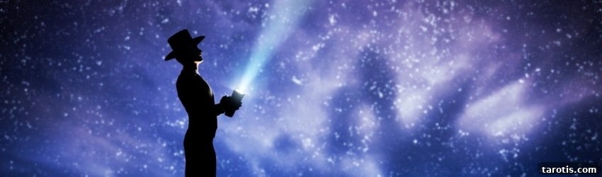 Weekly Astrology Forecast: August 16–22, 2021 — Planetary Insights 2 A shadowed figure stands, holding a flashlight up to the night sky. The expansive sky is illuminated by the white stars in shades of blue, purple, and black.