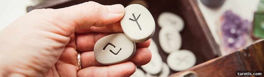 How to Read and Use Rune Stones: A Practical Beginner’s Guide 3 hand-holding-two-rune-stones