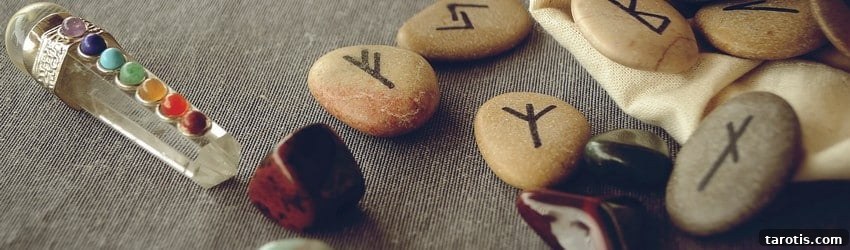 How to Read and Use Rune Stones: A Practical Beginner’s Guide 4 rune stones with crystals on table