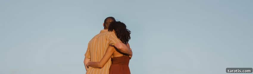 How to Seduce Each Zodiac Sign: Turn-Ons and Attraction Tips 2 A couple holds each other on a beach at sunset while looking at the distant full moon rising.