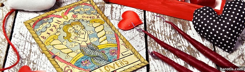 Accurate Tarot Love Readings: How to Interpret Your Heart's Cards 2 A love tarot spread on a table surrounded in heart shaped chocolates.