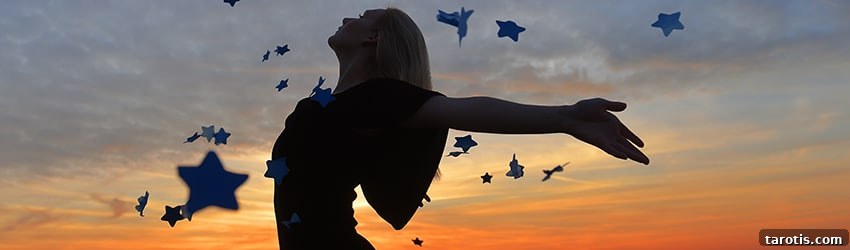 5 Dream Symbols That Reveal Your Inner Power 2 Woman dances under a starry sky.